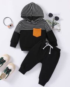 Toddler wearing a black striped baby tracksuit with matching jogger pants from ActiveKids Kenya.