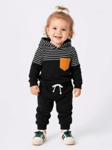 Best Baby Shop In Nairobi 2026 | Baby Clothes, Kids Clothes &Amp; More | Activekids Kenya 15 Toddler girl walking indoors in a black and white striped tracksuit set from ActiveKids.